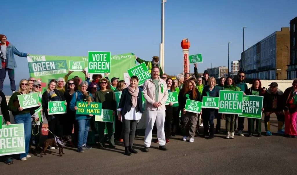 Photo of Green Party campaigners with placards and banners. Source: South East Green Party Facebook page.
